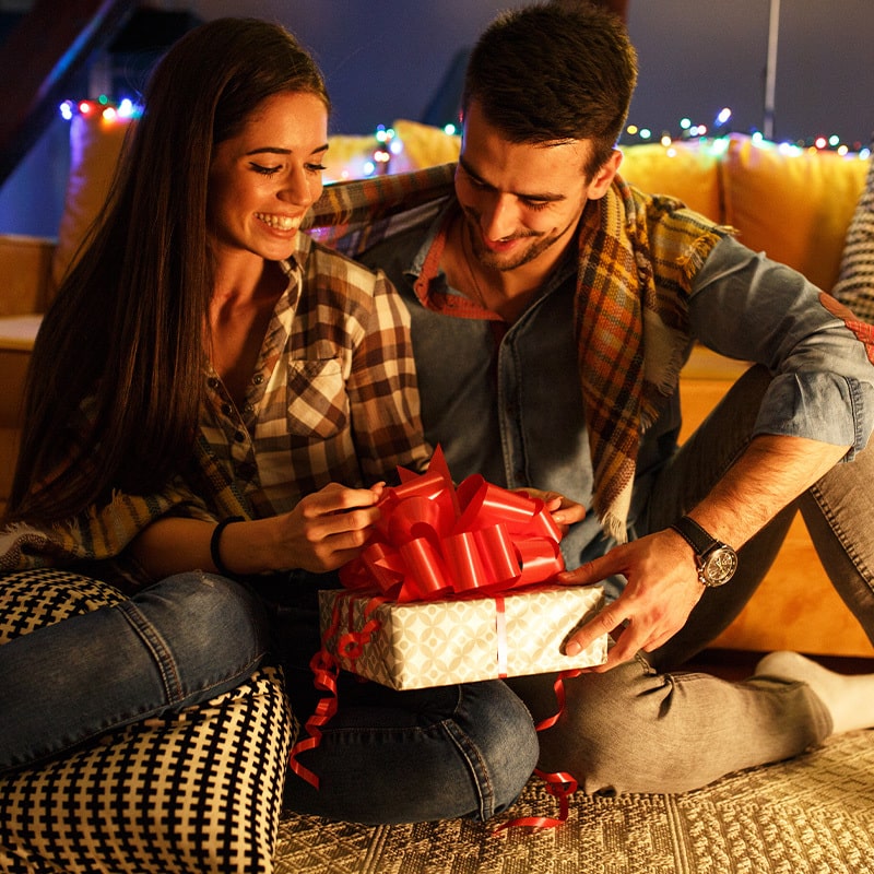 Guest giving gift to newly married