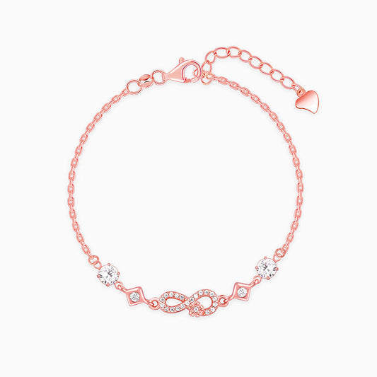 Rose gold infinity bracelet with zircon-studded floral and square motifs






