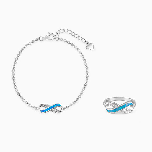 Silver infinity motif ring and bracelet set with zircon accents and inlay work.






