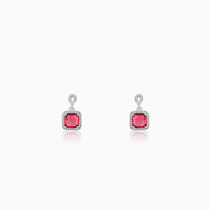 Silver earrings with pink stone and zircon accents in a square design.
