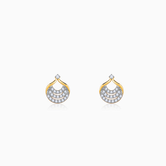 Pure gold earrings with diamond-studded interconnected loops, inspired by the moon's curves.