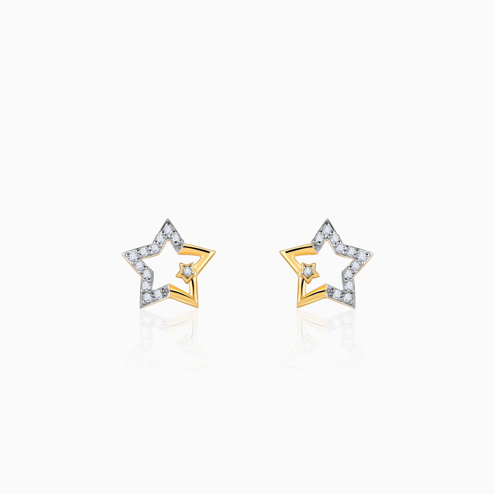 Pure gold star-shaped earrings with lab-grown diamonds.