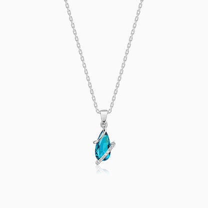 Silver pendant with blue stone drop and zircon accents
