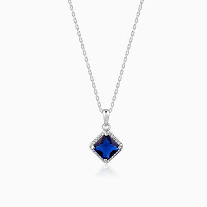 Silver rhombus pendant with blue stone and zircon accents
