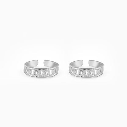 Silver toe rings with intricate knotwork design, offering a unique ocean-inspired look.